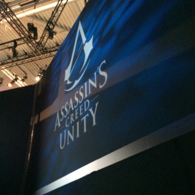 Assassin's Creed: Unity banner at the entrance of the Demo Theater