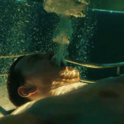 Aguilar submerged underwater, as seen in earlier screenshots and promo images.